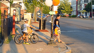 Mother and children cross at a stoplight in Somerville