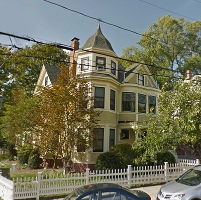 Somerville home built in the Queen Anne style, featuring a turret on its roof